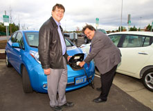 Associate Professor Roger Doering and Provost James Houpis charge a Nissan Leaf during the electric charging station's original unveiling on Nov. 20, 2012. (By: Jordan Chung)